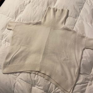 Cream colored women’s short sleeved cowl neck